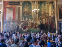 Replica of "The Crowning of Empress Josephine by Napoleon in Notre-Dame of Paris on 2 December 1804." Throngs of tourists blur make it difficult to tell where the life-sized painting begins and ends.