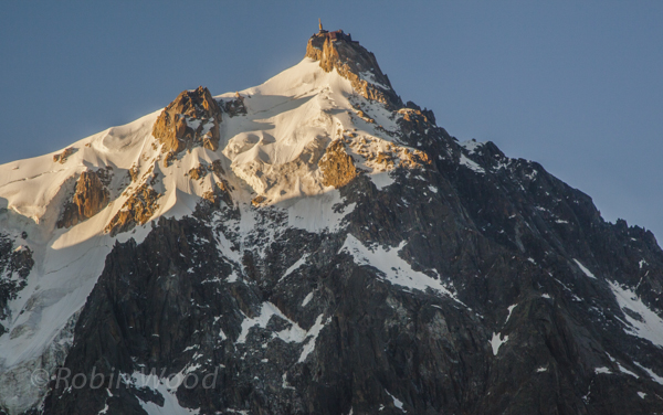 Closeup of Aiguille du Midi, a viewing platform  and communications tower high in the Alps.