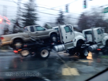 Truck towing a truck with a truck on the bed. Not pictured: a truck towing all three.